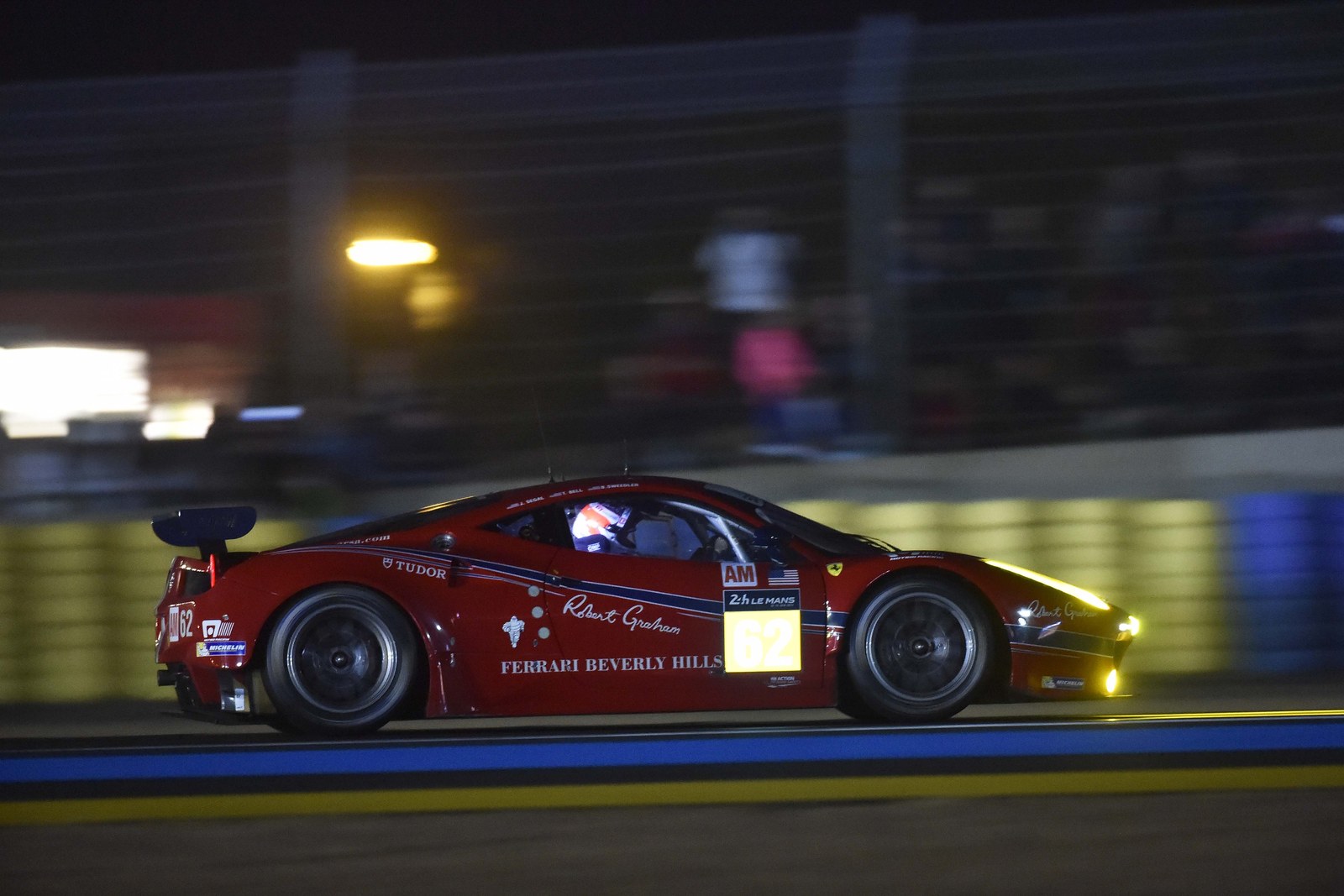 GT race car under lights during a night stint